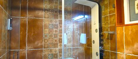 Shower, towels, soap, toilet paper