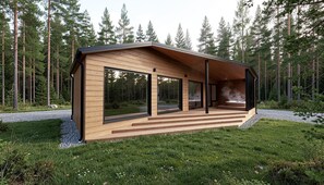 A modern cabin with large windows, a wooden deck, and a hot tub.