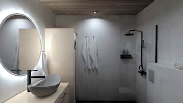 Suite Deluxe | Baño | Regadera, secadora de cabello, toallas, jabón