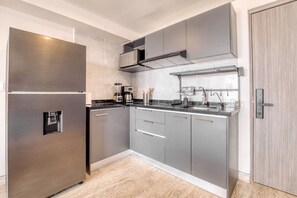 Fridge, microwave, stovetop, coffee/tea maker