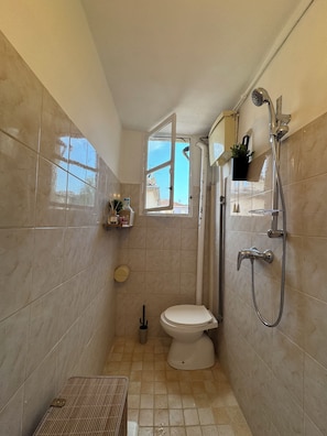 Shower, hair dryer, towels, soap