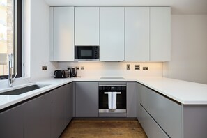 Apartamento, sacada | Cozinha privada