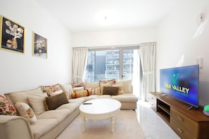Apartamento, vista para a cidade | Área de estar