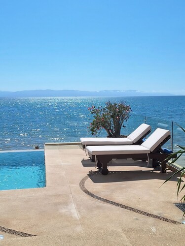 Luxury Beachfront Escape with Rooftop Pool & Views