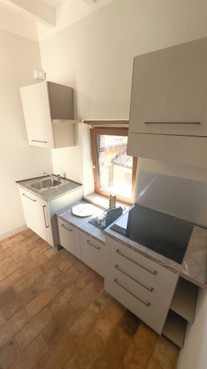 Apartment, City View | Private kitchen | Fridge, microwave, stovetop, electric kettle - Residenze del borgo  (Zavattarello)