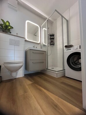 Shower, hair dryer, towels, soap