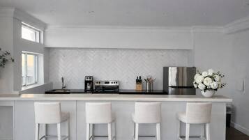 Ático presidencial, vistas a la ciudad | Cocina privada