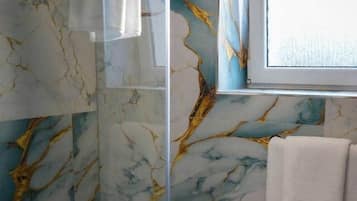 Shower, towels, toilet paper