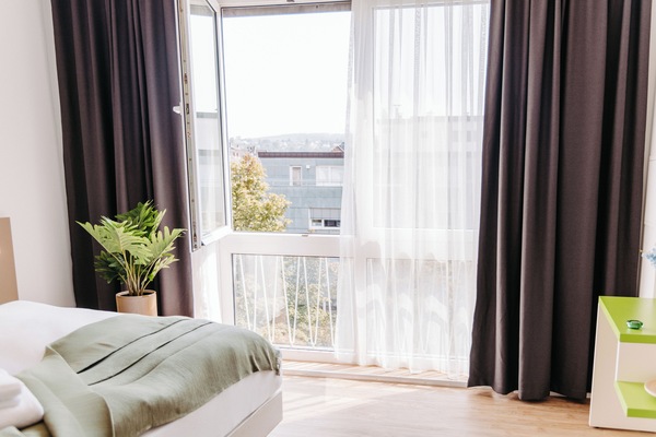 Premium bedding, desk, laptop workspace, free WiFi