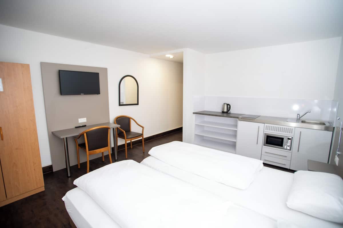 Double or Twin Room, Courtyard View | Desk, laptop workspace, soundproofing, iron/ironing board