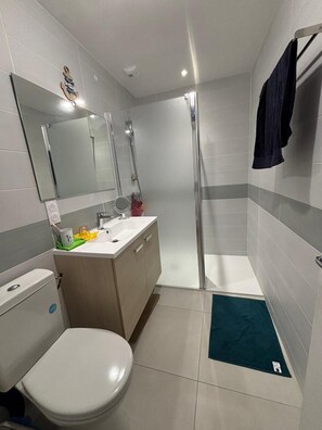 Shower, towels, soap, toilet paper