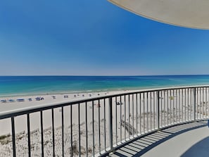 A balcony with a view of a beach, a railing, and a clear sky. - Island Royale Penthouse #202 by Southern Vacation Rentals (Gulf Shores)