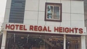A building with a sign reading "HOTEL REGAL HEIGHTS". - Hotel Regal Heights (Deoghar)