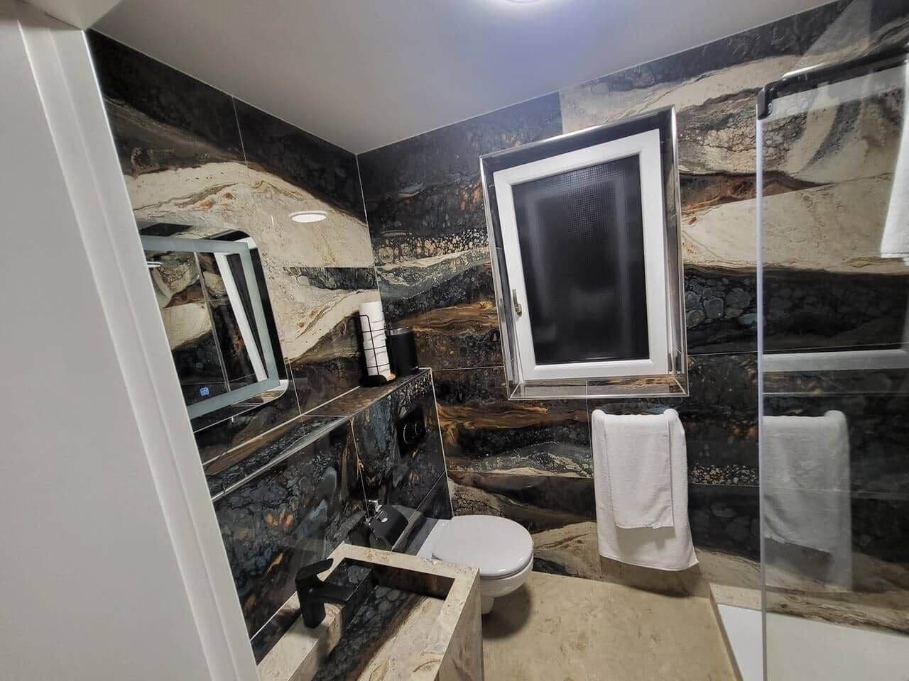 Shower, towels, toilet paper