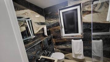 Shower, towels, toilet paper