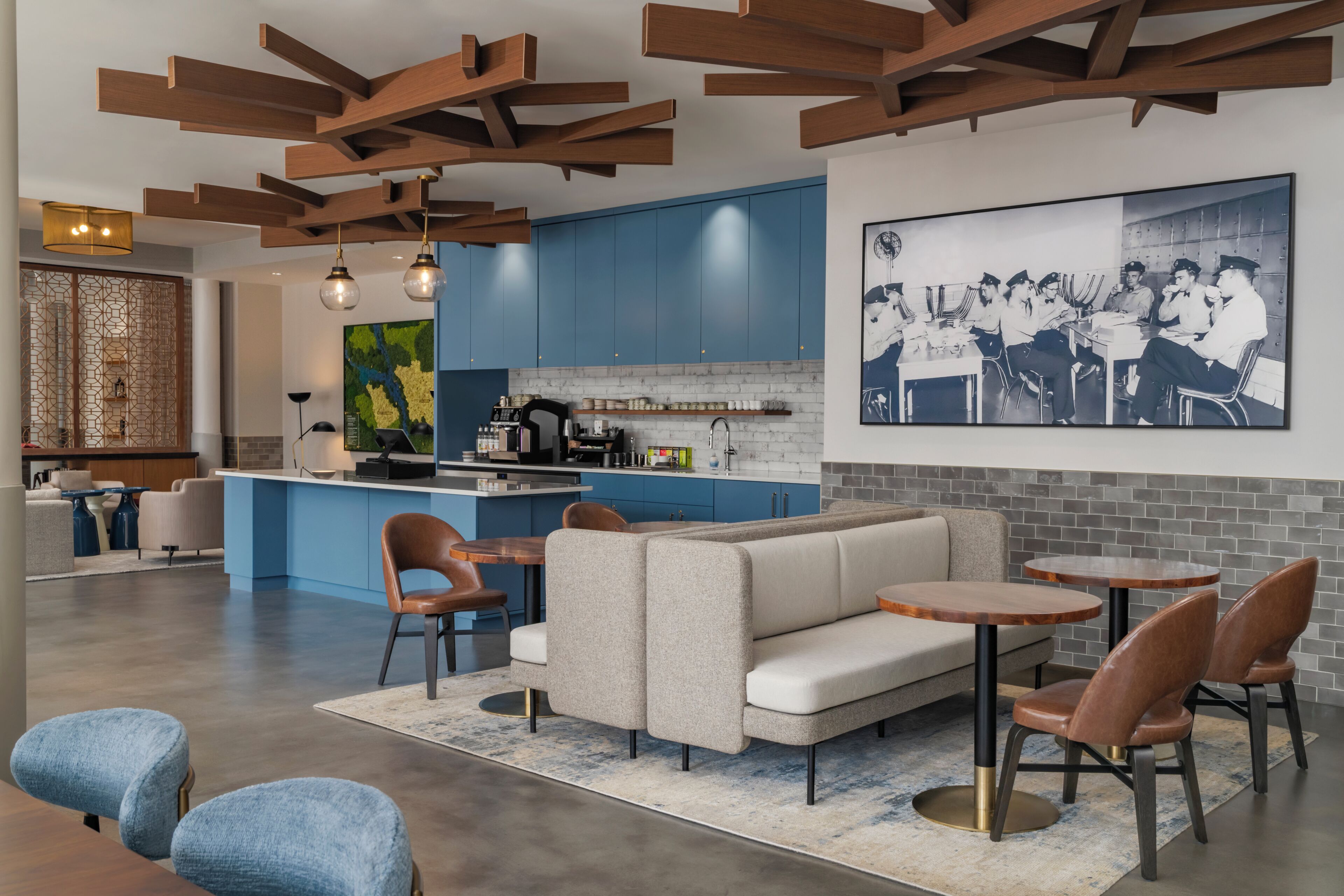 A modern interior with a kitchen, dining area, and living space.