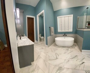 Shower, towels, soap, toilet paper