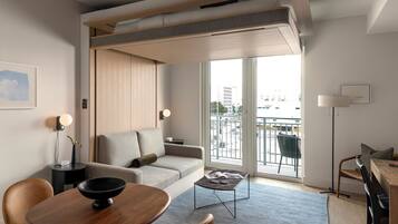 Studio Suite with Balcony | Living area | 55-inch Smart TV with digital channels