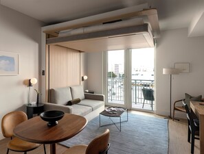 Studio Suite with Balcony | Living area | 55-inch Smart TV with digital channels