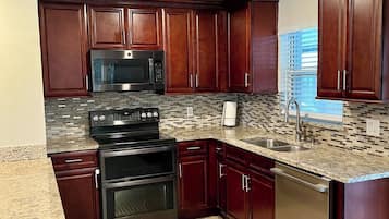Coffee/tea maker, fridge, microwave, oven