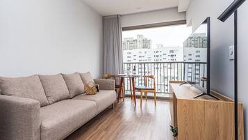 Gallery Apartment | Living area | 40-inch Smart TV with digital channels