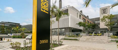 A modern building with a prominent 'FIRST' sign and the number '3950' on a pillar.
