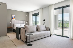 Premium Studio | Living area - First Residencial Multifuncional by Viva - Conforto e Fácil Acesso às Melhores Praias de Floripa (Florianópolis)