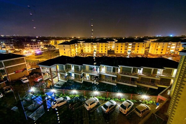 A multi-story hotel with a swimming pool and several parking levels. - Seasons Airport Hotel Nairobi (Nairobi)