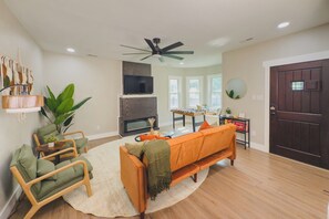 Smart TV, fireplace, foosball, books