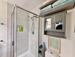Shower, towels, soap, toilet paper