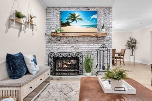 Smart TV, fireplace, books