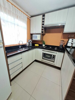 Microwave, oven, stovetop - Your Home in the City | 3 Bedrooms & Private Patio! (Igara Canoas)