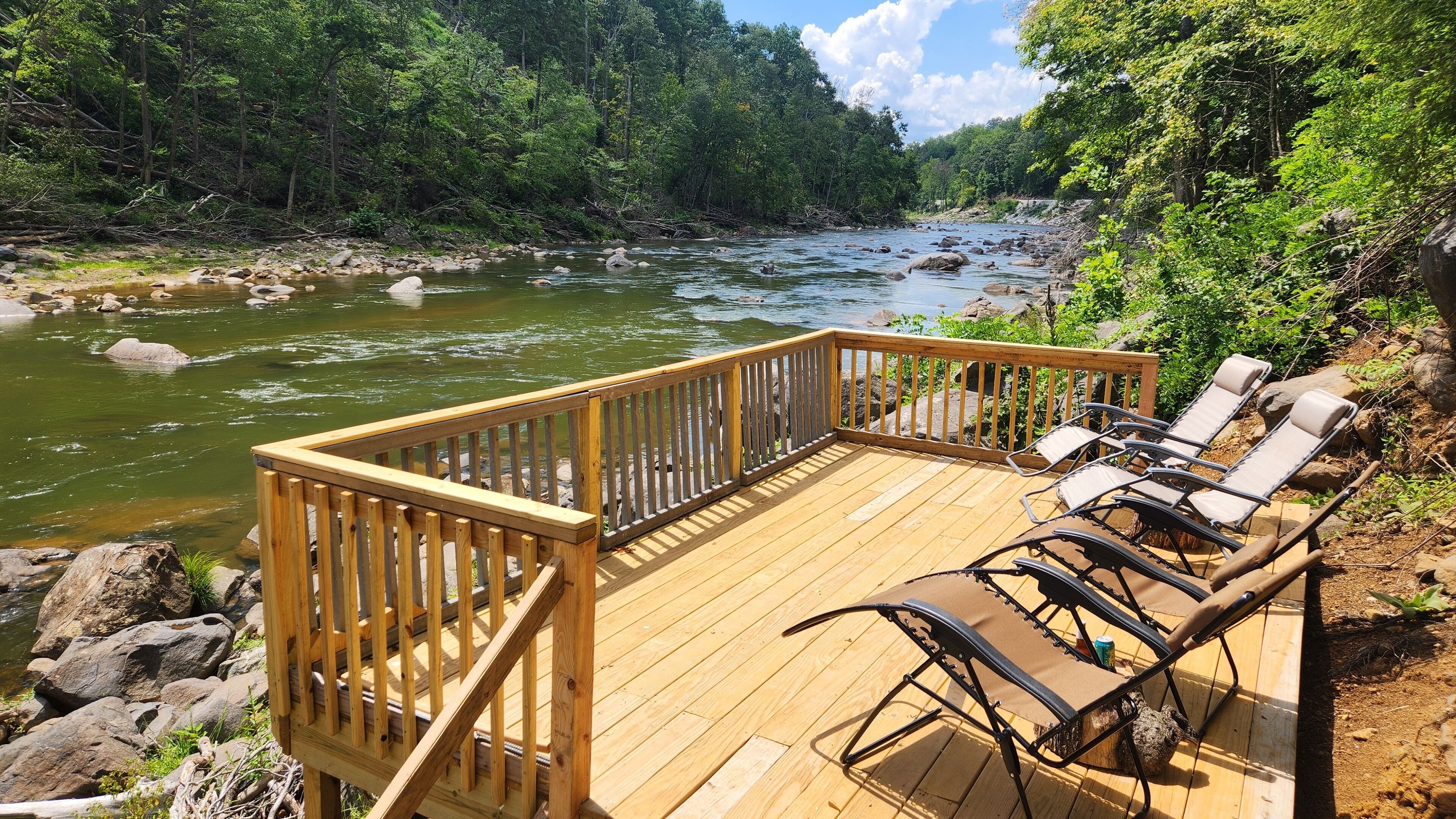 Brand new river deck with zero gravity chairs looking downstream