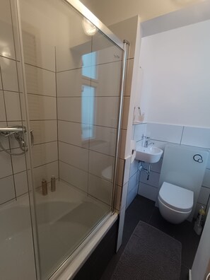 Shower, hair dryer, towels, soap