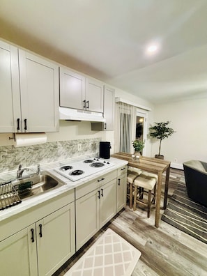 Fridge, microwave, stovetop, coffee/tea maker