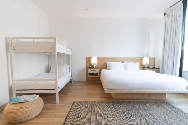Unwind in a bright, airy bedroom with crisp linens.