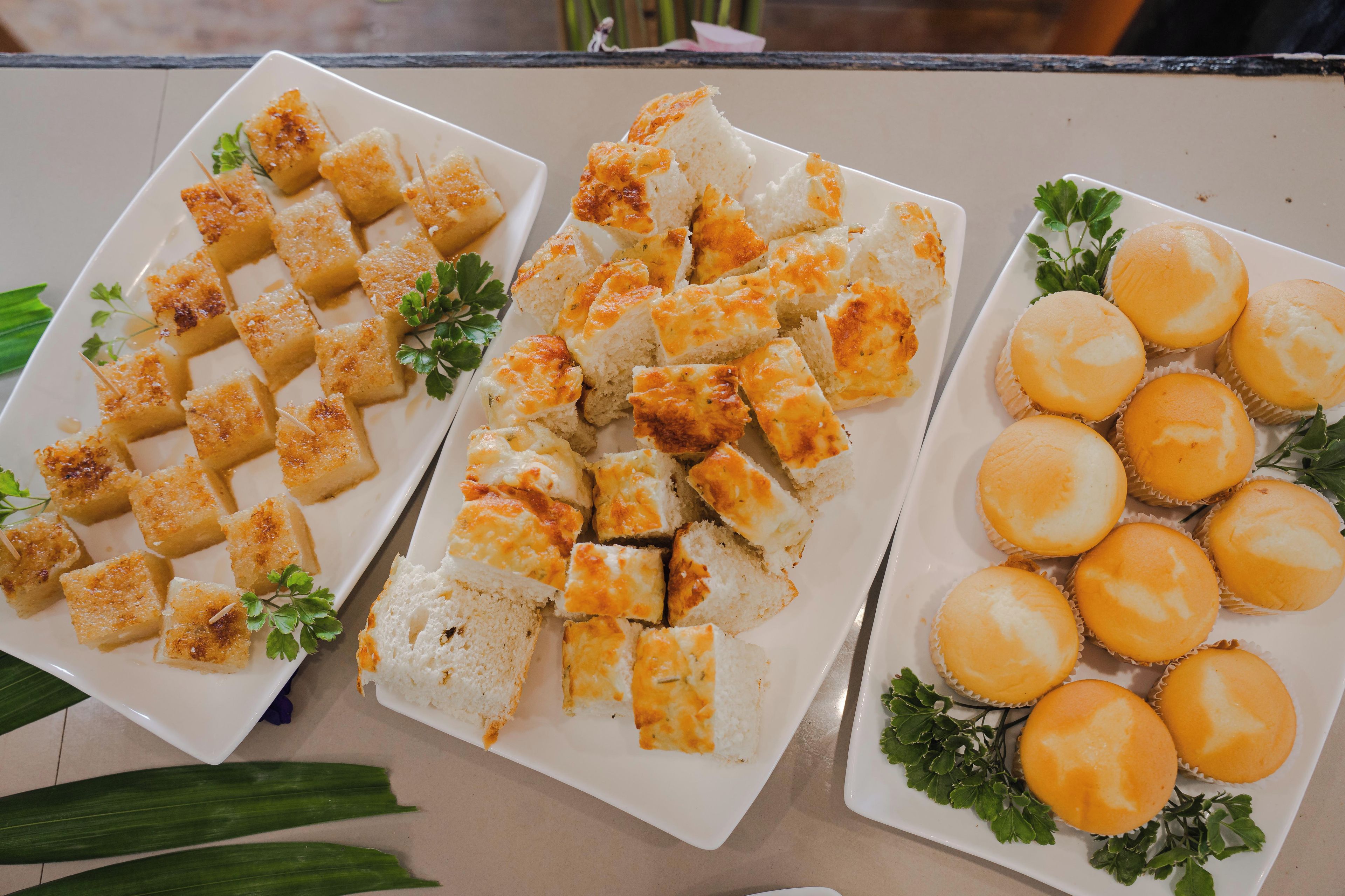 A buffet table with various food items.