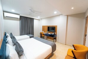 Deluxe Triple Room, Multiple Beds | Desk, laptop workspace, iron/ironing board, free WiFi