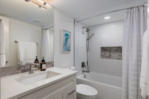 Shower, hair dryer, towels, shampoo