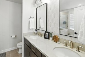 Shower, hair dryer, towels, shampoo
