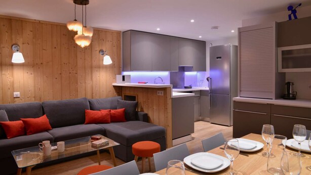 A modern kitchen with grey cabinets, a built-in oven, and a stainless steel refrigerator. - Belle Plagne Premium : ski in & out / 8 personnes (MACOT LA PLAGNE)