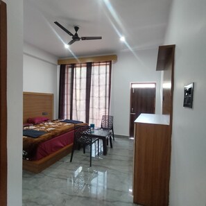 Deluxe Double Room, Balcony, River View | In-room safe, desk, laptop workspace, blackout curtains