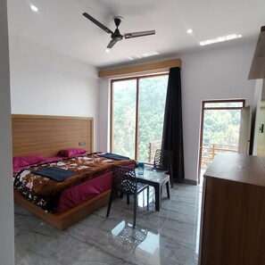 Deluxe Double Room, Balcony, River View | In-room safe, desk, laptop workspace, blackout curtains