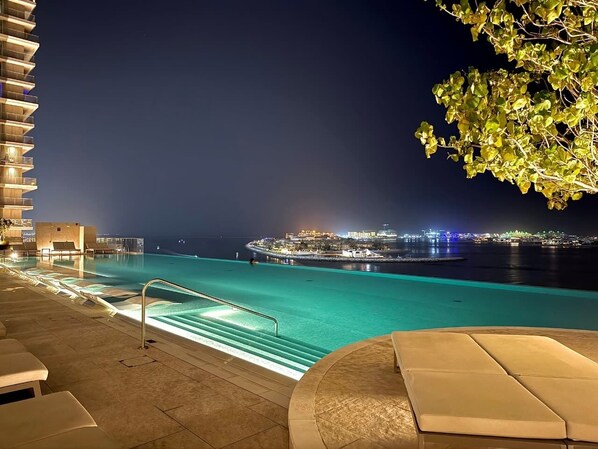 Pool - Seaside Bliss Chic 1BR with Balcony, Pool & Gym (Dubai)