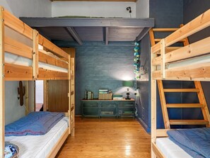 A compact room with bunk beds, a desk, and a chair. - "Arsi" - 1.8km from the sea by Interhome (Blokhus)