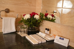 Shower, hair dryer, slippers, towels