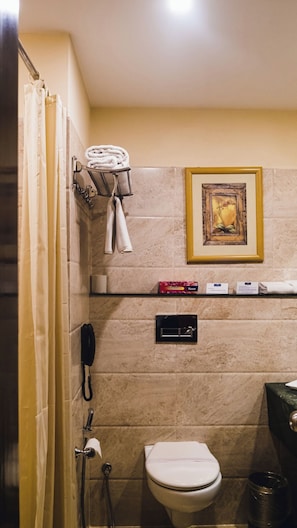 Shower, hair dryer, slippers, towels