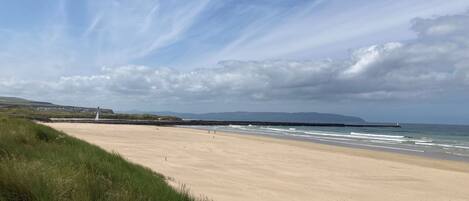 On the beach, sun loungers, beach towels