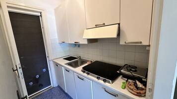 Fridge, microwave, cookware/dishes/utensils