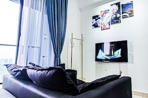 Suite Deluxe, balcon, vue ville | Fer et planche à repasser, Wi-Fi gratuit